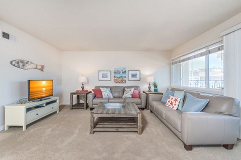 Main living area with access door to front ocean view balcony.