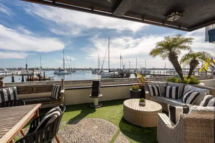Relax on the waterfront patio and watch sailboats drift through Newport Harbor