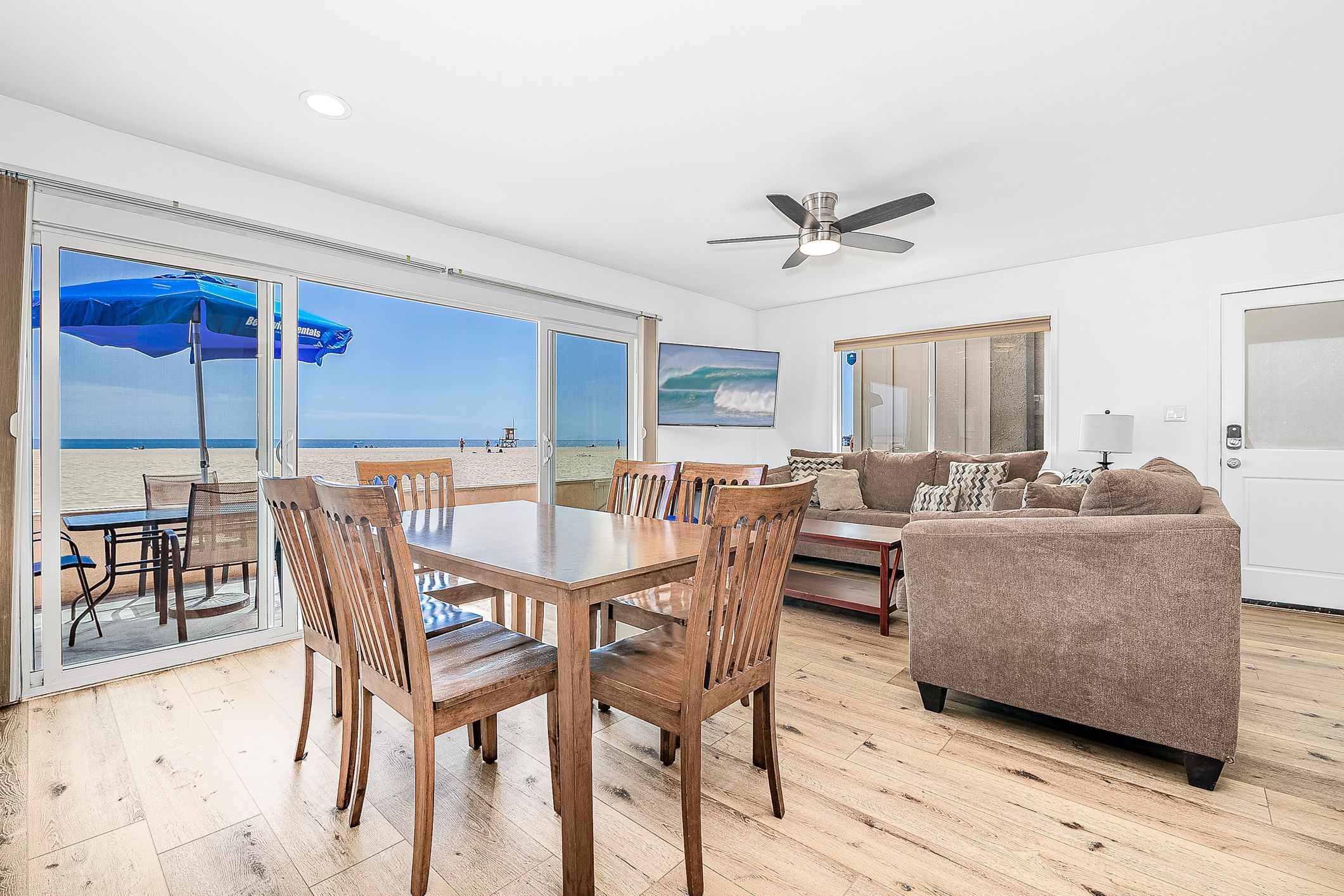 Sliding doors open from the living area to the front patio and beachfront. Vacation is served!