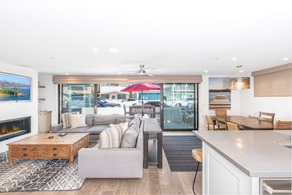 Spacious living and dining areas open up via disappearing sliders to the front patio of this high end, downstairs 3bd/3 ba ocean view unit.