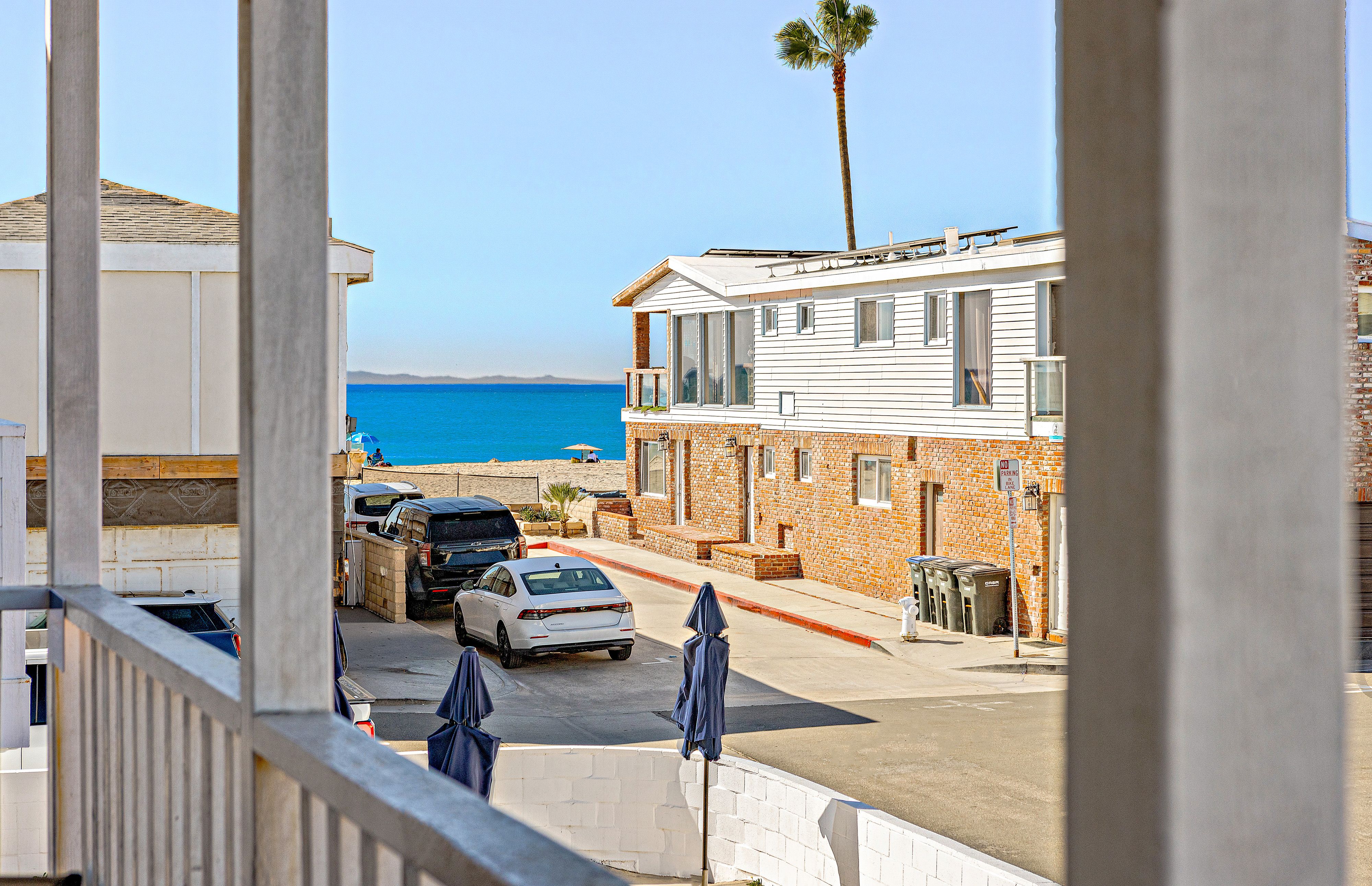 Peek-a-boo ocean view from the front balcony, just steps from the beach