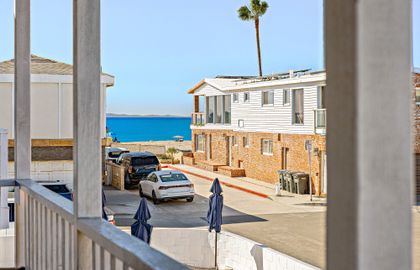 Peek-a-boo ocean view from the front balcony, just steps from the beach