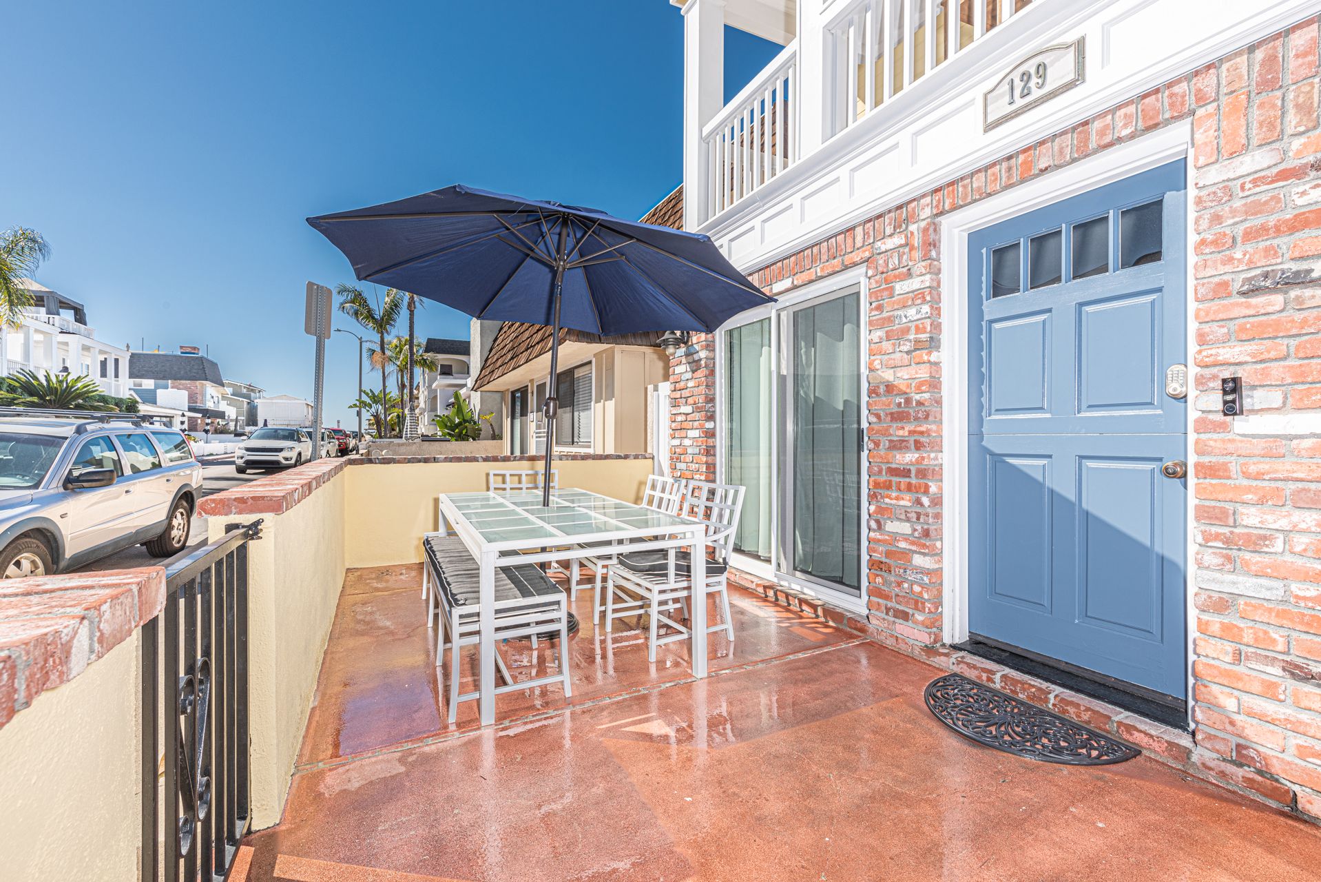 The front patio is the perfect spot to catch morning and afternoon sunshine. It includes a dining table for 6 and a built-in gas BBQ grill.