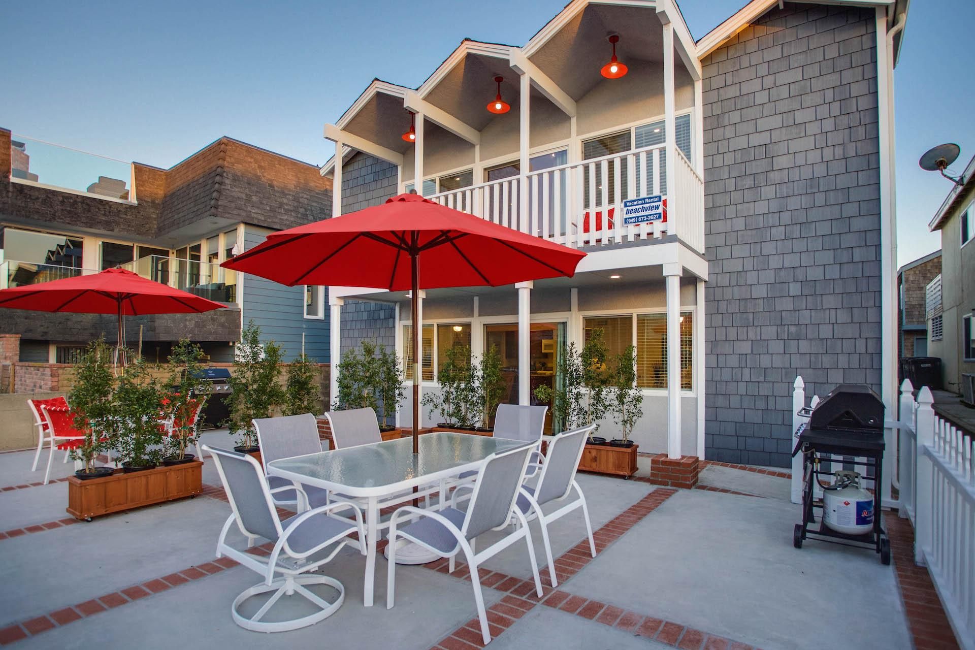 Oversized front ocean view patio is shared with downstairs unit. However, each unit has its own designated BBQ grill and outdoor dining table, seating and umbrella.