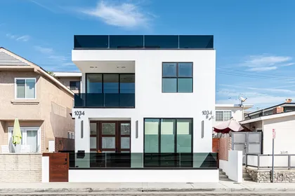 Contemporary multi-level luxury condo showcasing sleek architectural design just steps from the beach