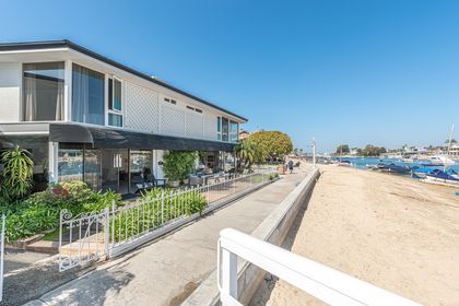 View of the exterior of the home, located on a double-wide, bayfront lot on the iconic Balboa Island in Newport Beach.