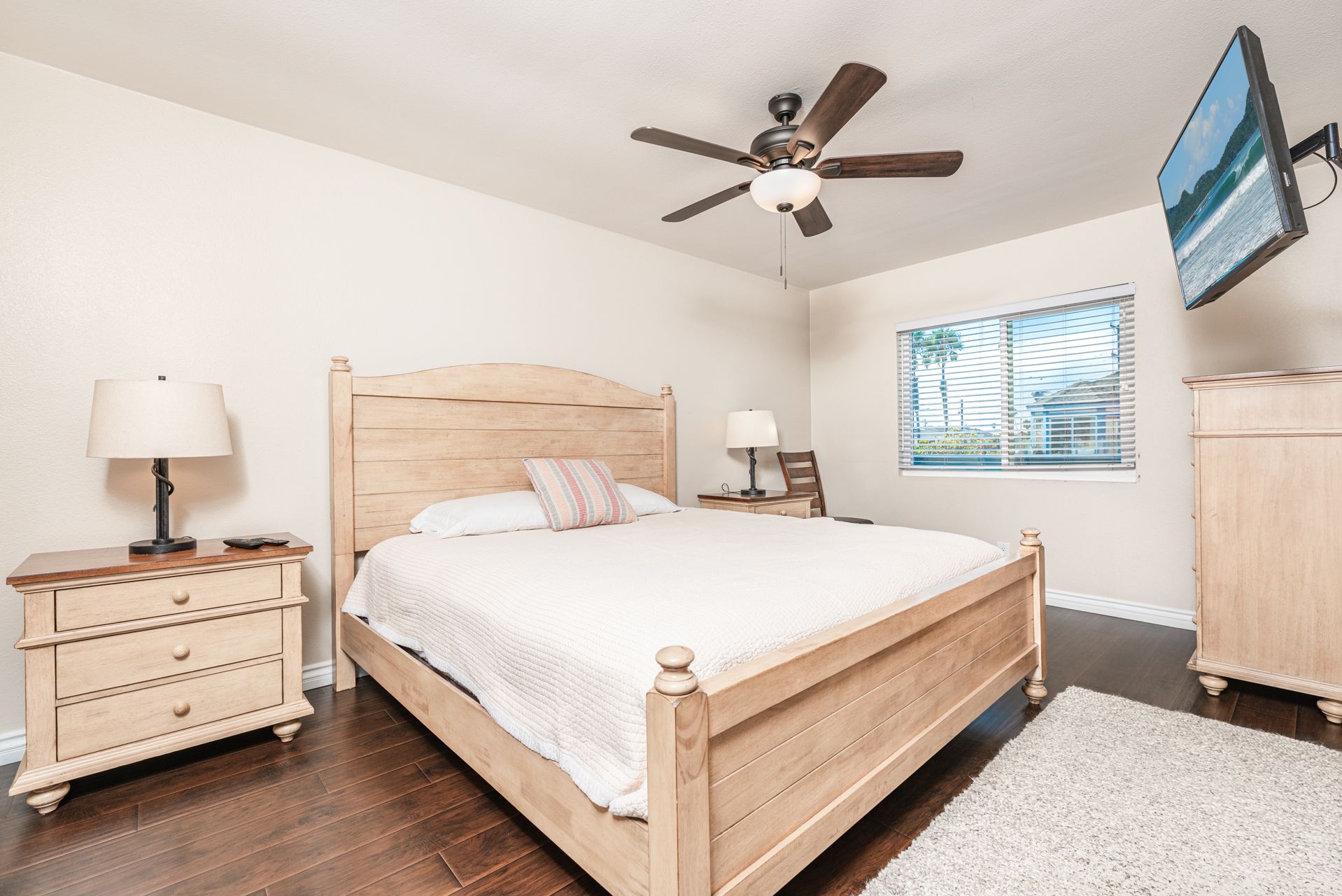 You'll find a king bed, TV, and en suite bathroom in the apartment's bedroom.