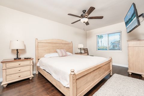 You'll find a king bed, TV, and en suite bathroom in the apartment's bedroom.