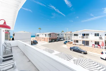The front balcony includes a gas propane grill, the perfect set up for sunset cookouts