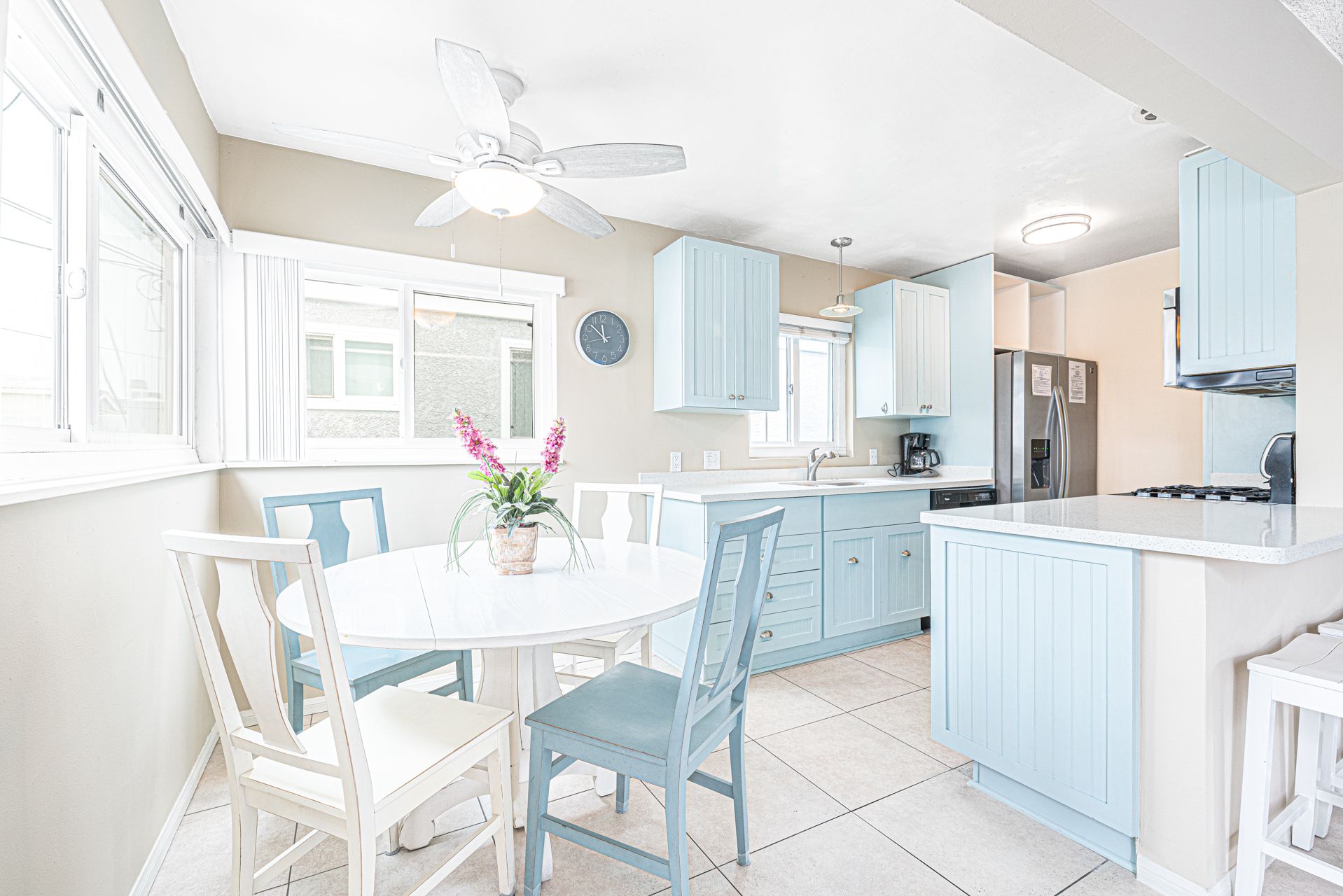 Bask in the warm glow of natural sunlight as you gather around our inviting circular dining table with seating for four.