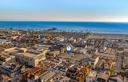 From above, the property is showcased in its prime coastal setting, beautifully framed by the sweeping shoreline.