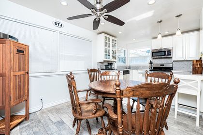 Just behind the dining room table is a bar area with bar stools, so the house chef can cook with an audience!