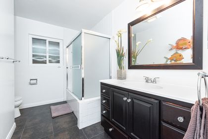 Upstairs bathroom located near master bedroom. Includes a tub/shower combo.