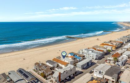 Wake up to sweeping views of the Pacific and Newport’s iconic oceanfront boardwalk.