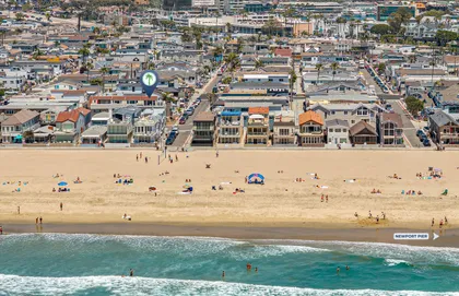 Bird’s-eye view of the Newport Beach shoreline with the home just steps from the sand
