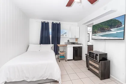 Studio layout featuring kitchenette and second full-size bed