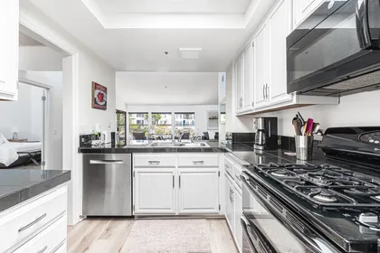The cook's view out to the living, dining and patio areas.