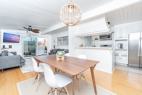 Just nine homes from the sand, this bright and cheery upstairs unit makes vacationing at the beach a breeze.