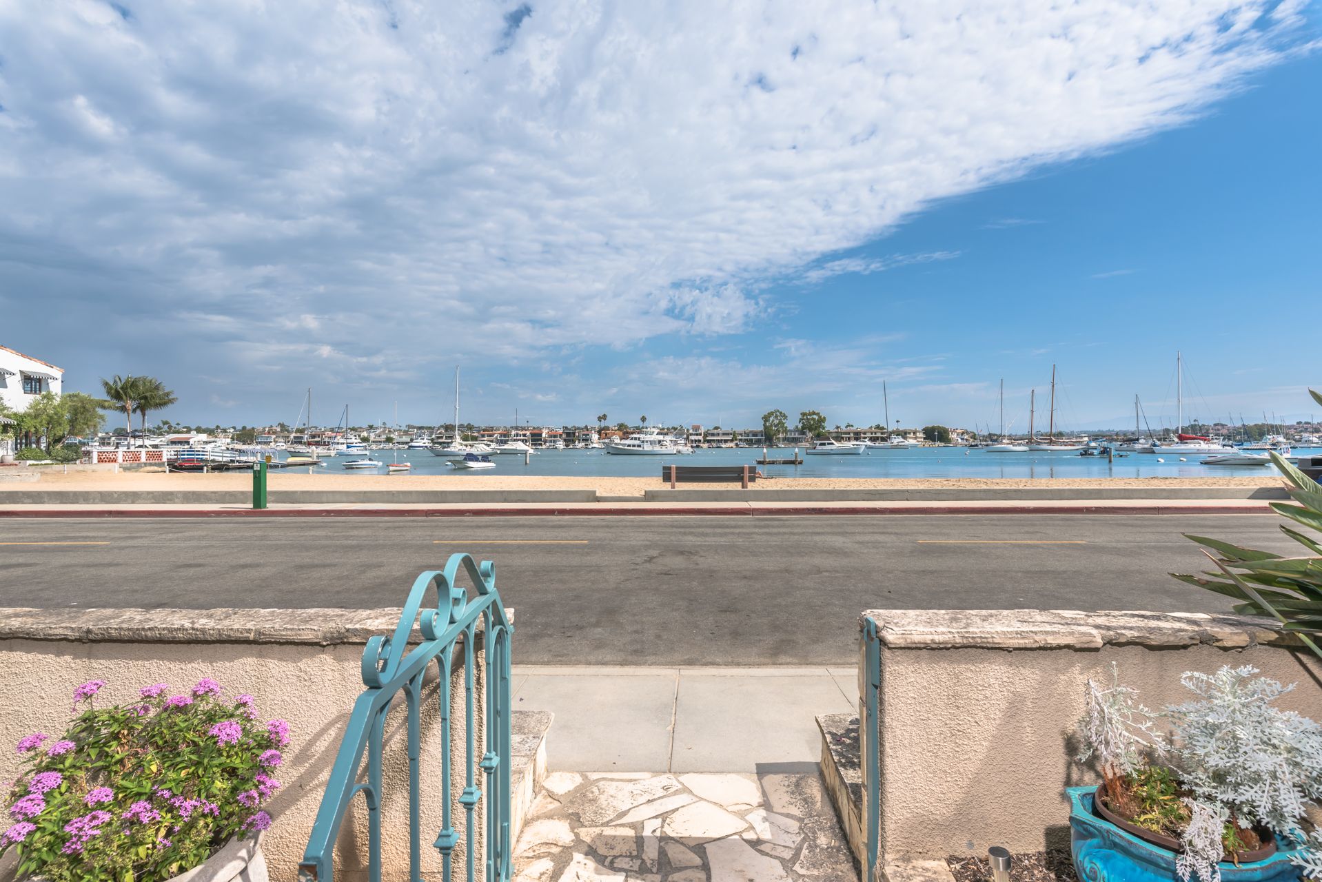 To access the bayfront beach from the apartment, guests can use the property's side walkway. Note: the apartment itself does not have a bay view.