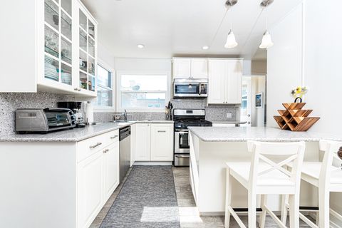 The bar area with bar stools is a perfect additional seating area so the house chef can cook with an audience!