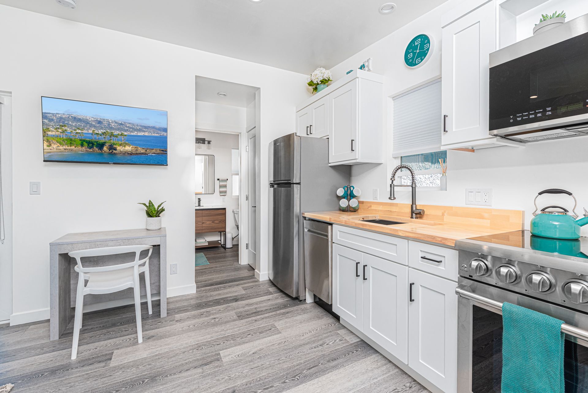 The bathroom is conveniently located off of the kitchen.