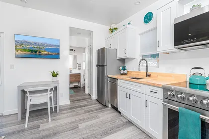 The bathroom is conveniently located off of the kitchen.