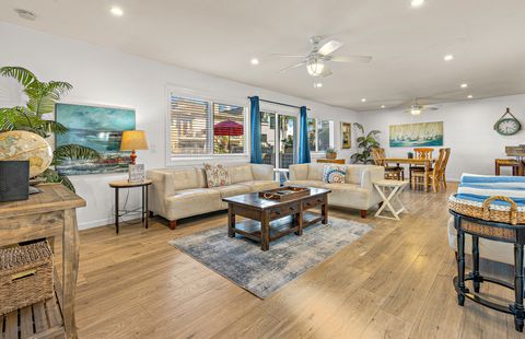 Spacious open living area with comfortable seating and coastal décor—perfect for relaxing after a day at the beach