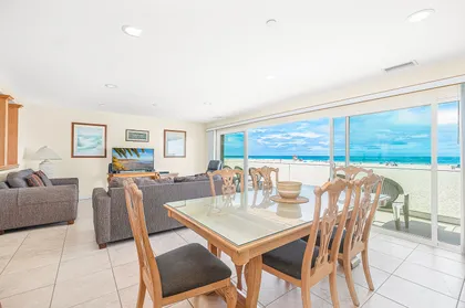 The main living area includes a sofa set with queen pullout sofa bed and cable TV