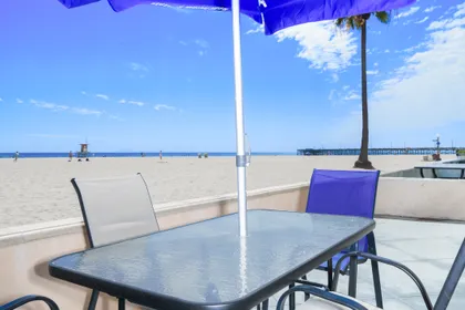 Private oceanfront patio with front-row beach views