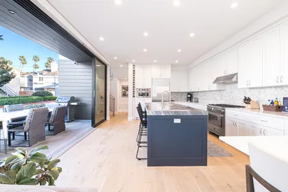 The kitchen is outfitted with premium stainless steel appliances and all the necessary cook and bakeware