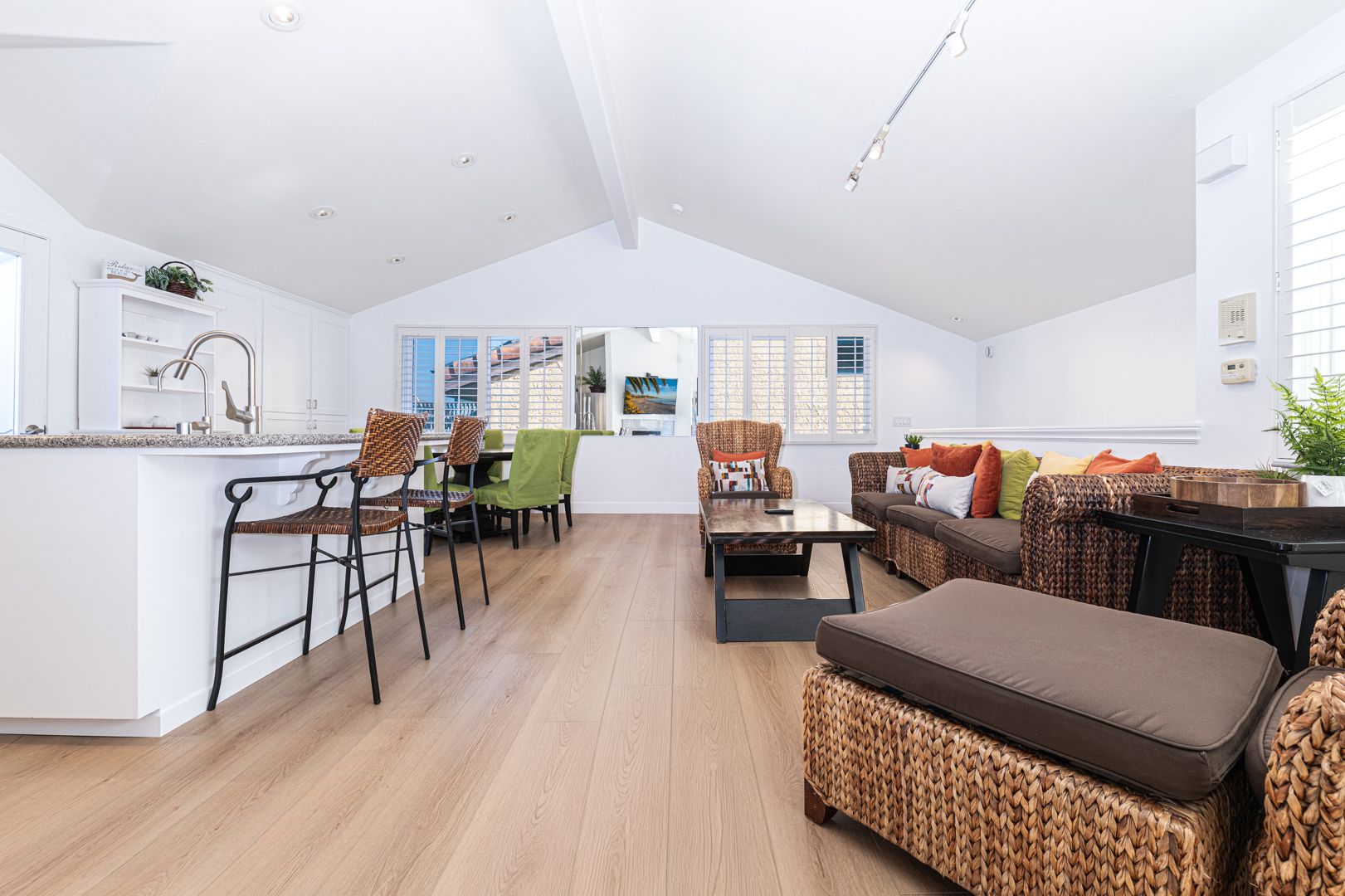 From chef-ready kitchen to relaxed living area, this seamless layout invites connection, conversation, and carefree coastal living