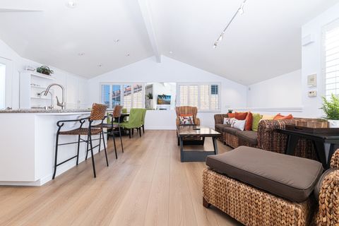 From chef-ready kitchen to relaxed living area, this seamless layout invites connection, conversation, and carefree coastal living