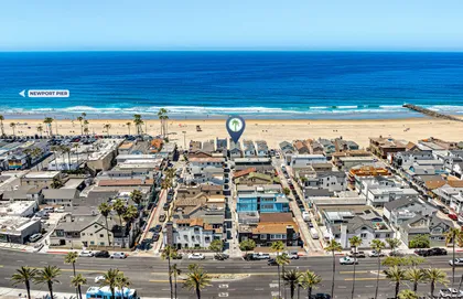 Aerial view showcasing your prime beachfront location with the sand and surf just steps away