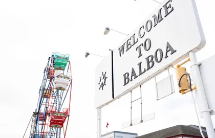 Ride the ferry to the historic Balboa Fun Zone, featuring a classic Ferris wheel, arcade games, waterfront restaurants, and local coffee shops.
