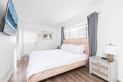 Light-filled primary bedroom with refined coastal simplicity