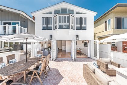 Enjoy picturesque harbor views from the main downstairs area and upstairs primary bedroom.