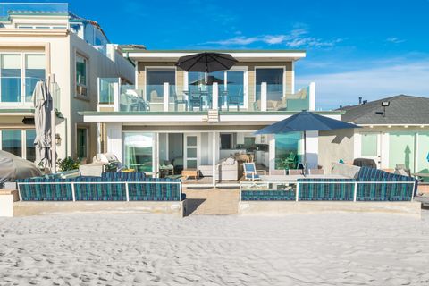 This paired offering is for both the ground-floor and upper residence of this beachfront duplex