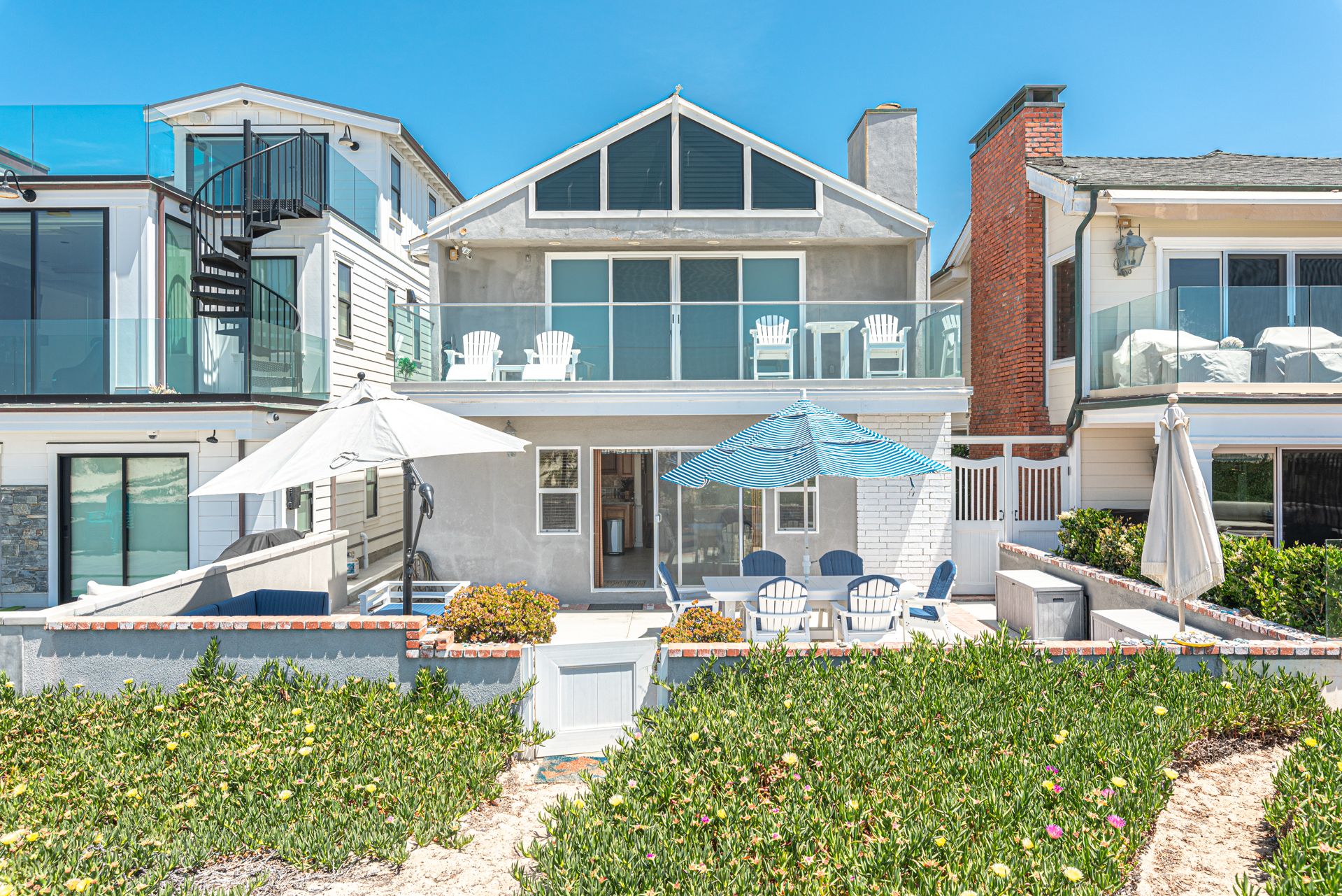 Unwind on the spacious front patio, with plenty of spots to read, soak up the sun, and live the good life. This listing pertains to the lower unit.