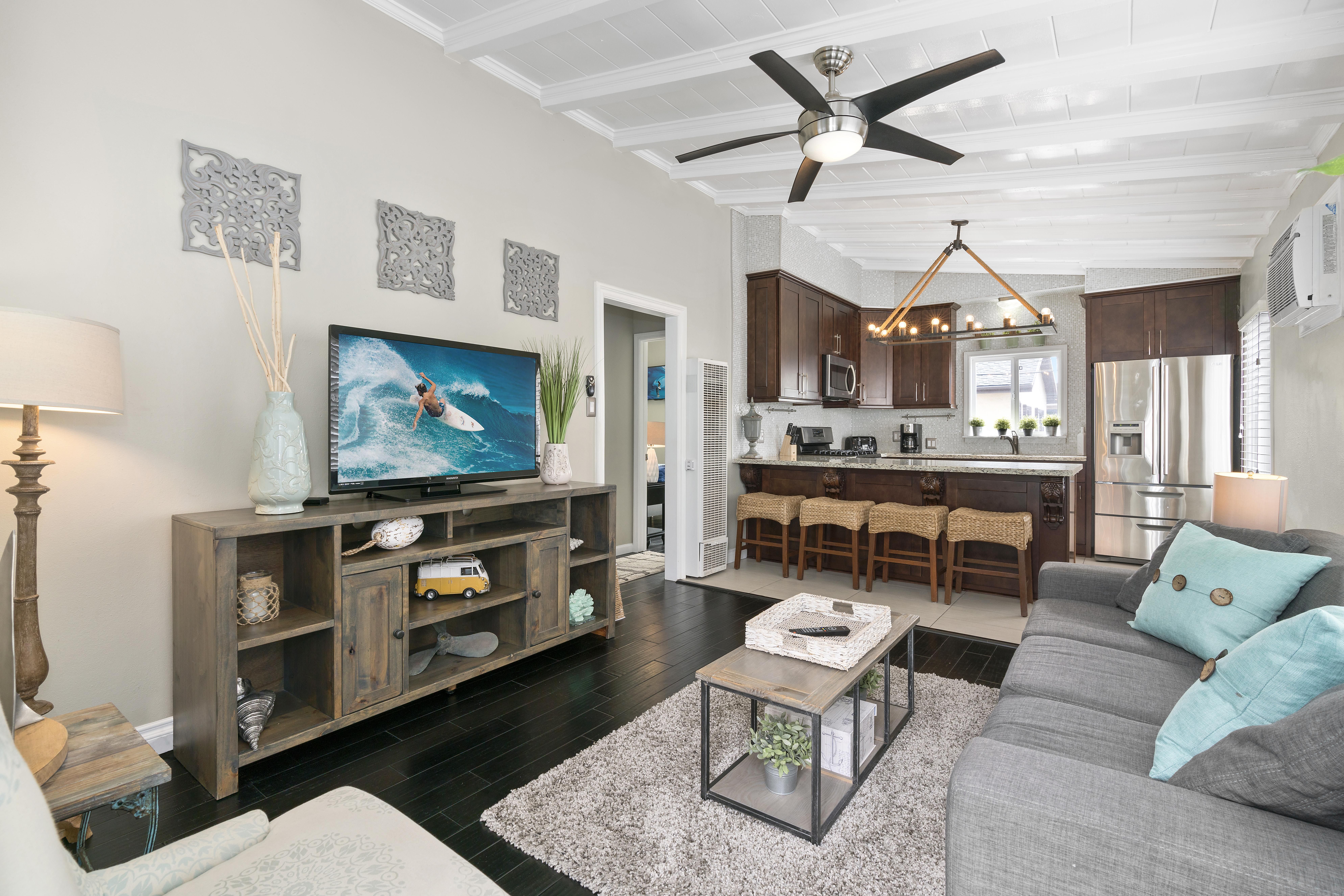 View of main living spaces from the front Dutch door entry. Open floor plan between living, kitchen and eating areas.