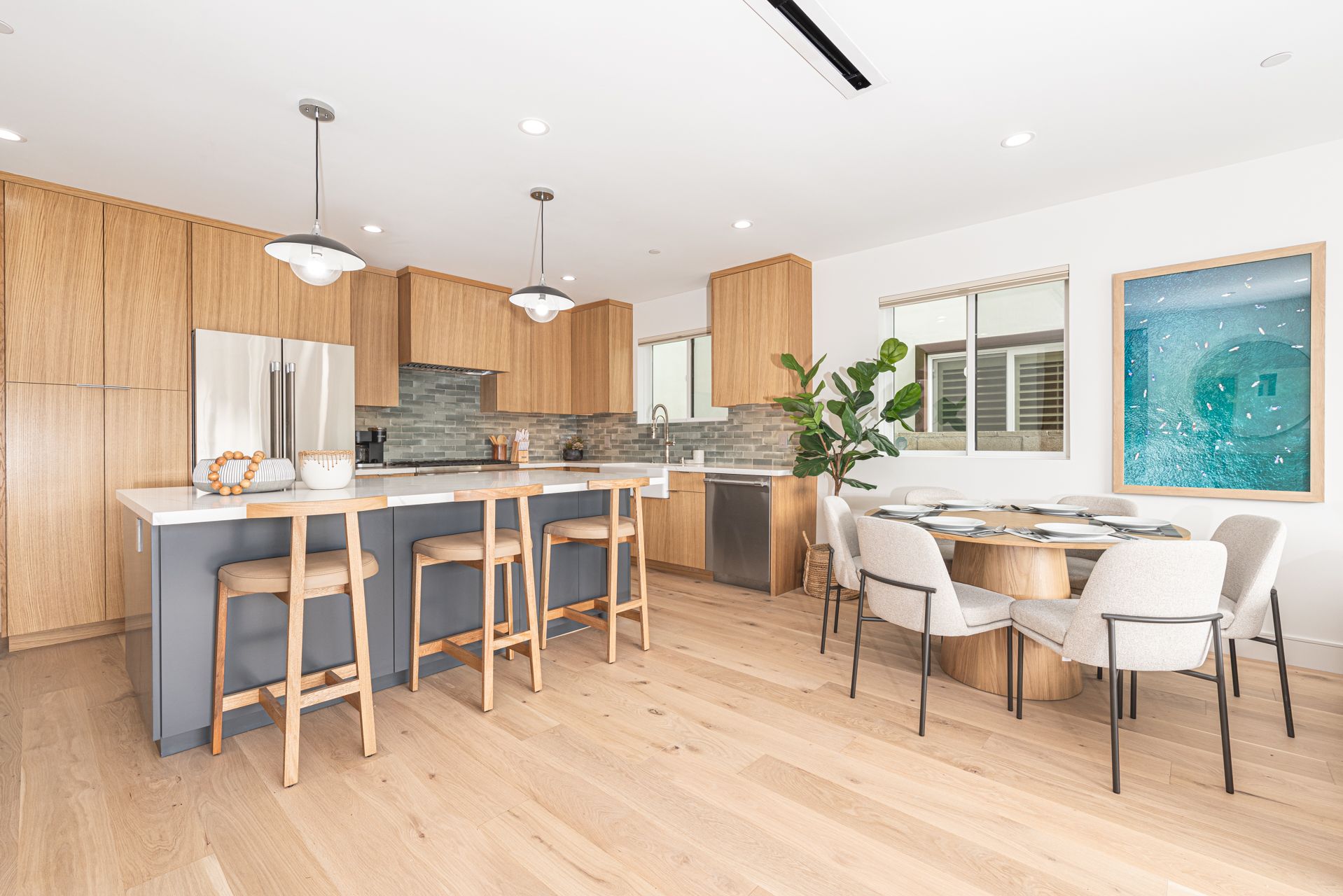 Our open-concept kitchen is perfect for entertaining, featuring a central island with barstool seating and a dining table that accommodates up to 6 guests.