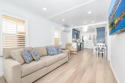 The living area opens up to the kitchen, making meal prep a social affair!