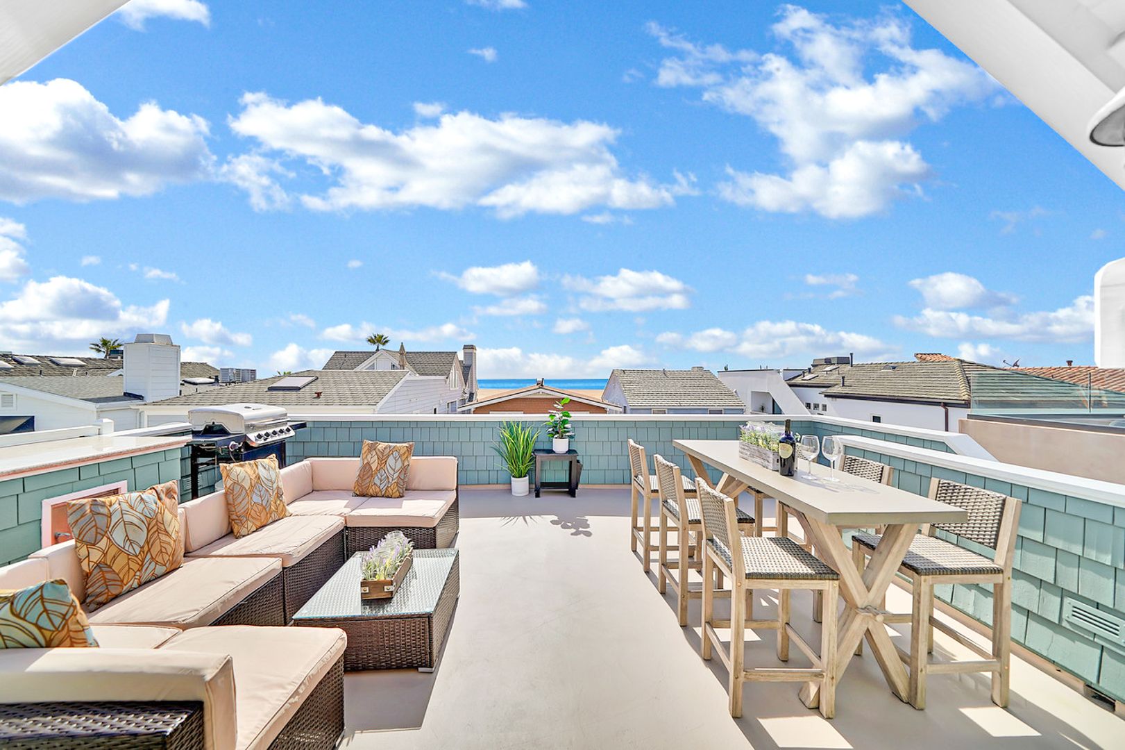 There's not one but two rooftop decks on the third level of this home. This is the Oceanview deck, with ample outdoor seating and a propane gas BBQ grill.