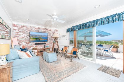 Large sliding doors offer fabulous beach views from every vantage point in the front living area.