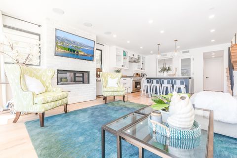 Top grade fixtures, tech, and designer furnishings are found throughout. Open floor plan on the ground level includes living, dining and patio areas.