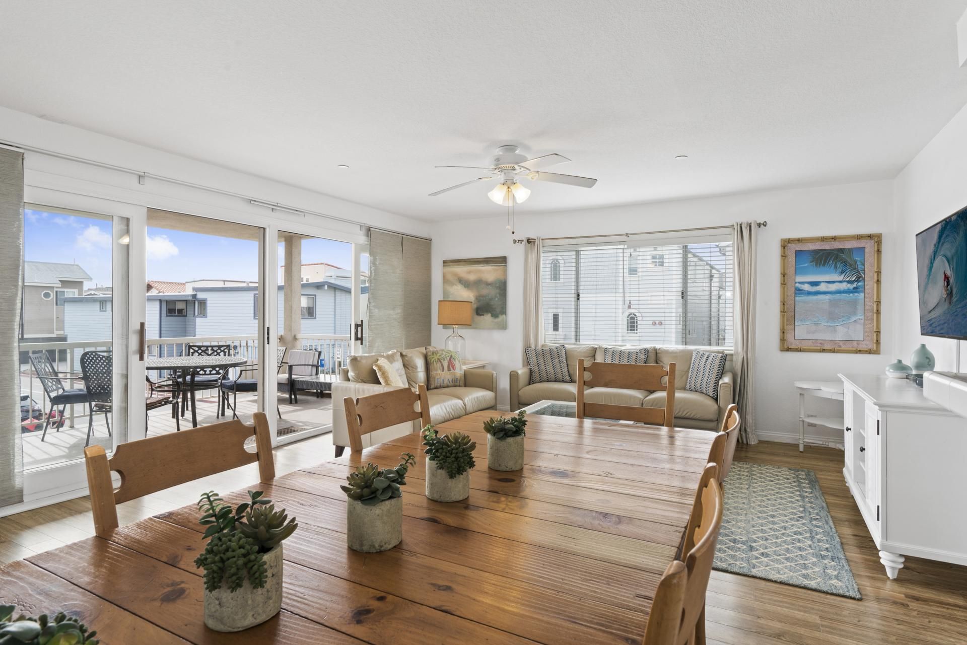 Spacious living and dining areas open up to the front, second level balcony of this upper 4 bd/2 ba ocean view unit. Two stairways lead to third level deck and bonus room.