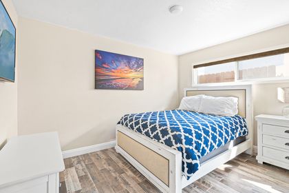 The bedroom includes a queen bed and Roku TV.