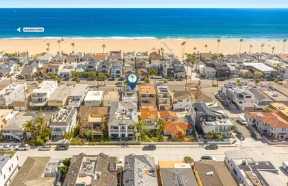 Aerial view highlighting the home’s prime location just steps from the sandy shores of Newport Beach