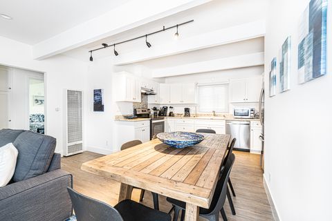 The dining area includes seating for 6 and opens out to the kitchen, making meal prep a social affair!