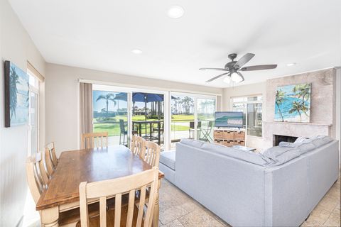 Sliding doors open from the living room to invite in that fresh ocean air, making indoor/outdoor living a breeze!