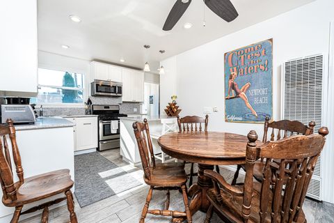 Small, but simply delightful! This upper unit transitions from kitchen, dining, and living room (behind dining table) seamlessly.
